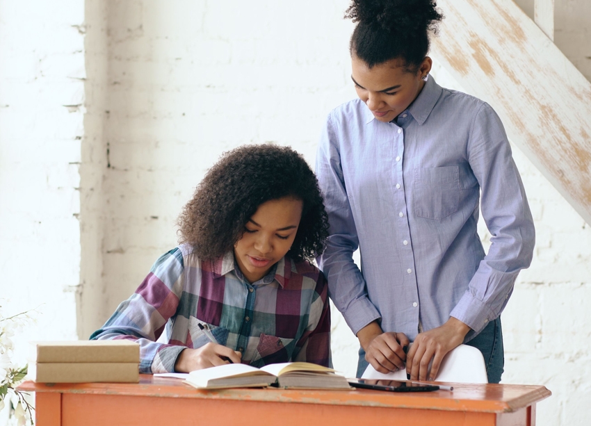 image of someone offering support and guidance to another young adult